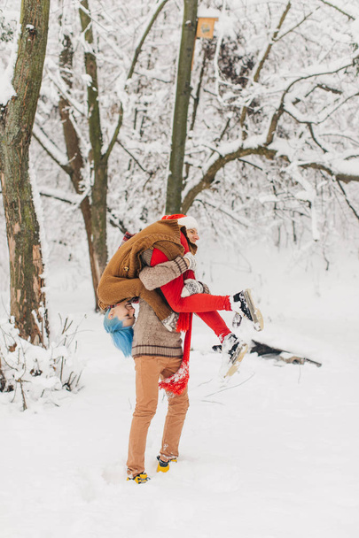 couple in love lie in the snow, laugh and enjoy - 写真・画像