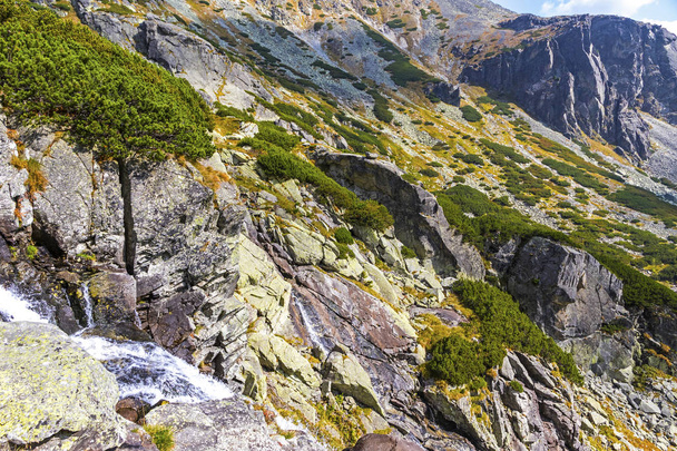 Hiking in High Tatras Mountains (Vysoke Tatry), Slovakia. Skok waterfall (Slovak: Vodopad Skok). 1789m. One of the most beautiful Tatra waterfalls. The seasonal closure is from Nov 1 to June 15 - Φωτογραφία, εικόνα