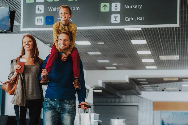 Delighted parents with son are waiting for trip by plane - Fotografie, Obrázek