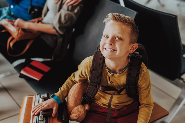 Delighted child is looking forward to flying on holiday - Foto, Imagem