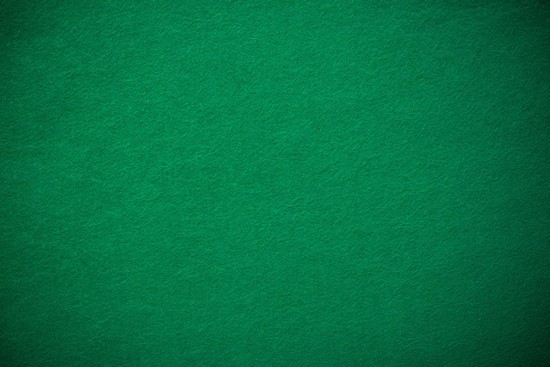 Empty green casino poker table cloth with spotlight. - Photo, Image