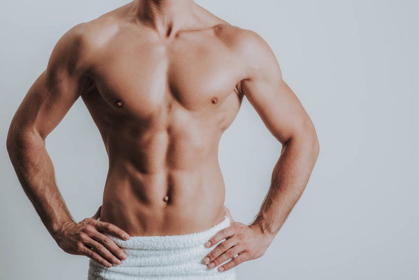 Muscular topless man posing with hands on the hips - Φωτογραφία, εικόνα