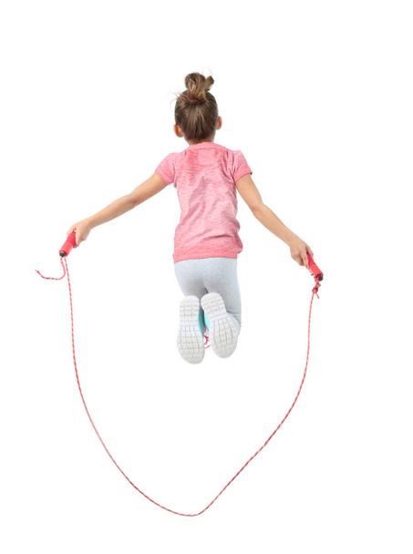 Active girl jumping rope on white background - 写真・画像