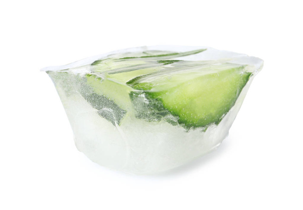 Ice cube with cucumber slices and rosemary on white background - Foto, Imagen