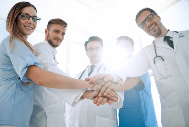 Doctors and nurses coordinate hands - Foto, imagen