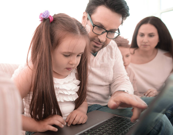 close up.dad teaches his daughter to use a laptop - Φωτογραφία, εικόνα