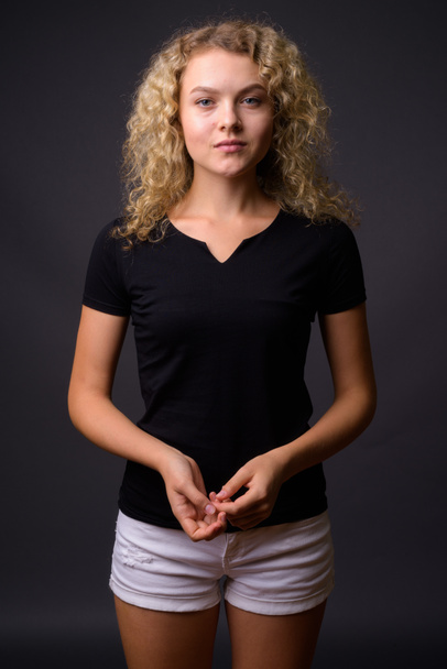Portrait of young beautiful woman with curly blond hair - Φωτογραφία, εικόνα