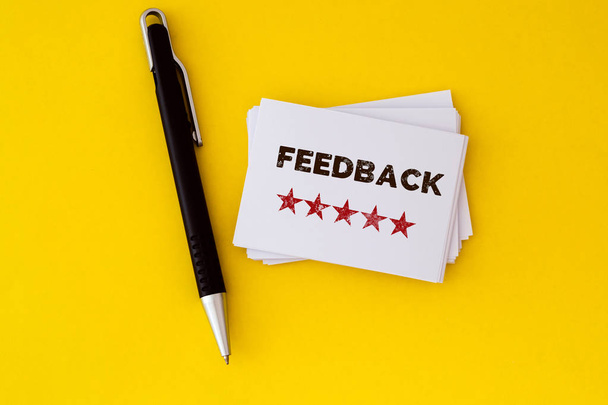 stacking of Feedback with five star drawn on white business card , excellent customer satisfaction feedback concept - Photo, Image
