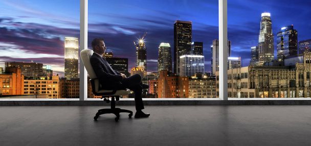 Businessman in an empty office for a startup or failure and bankruptcy in city of LA - Photo, Image