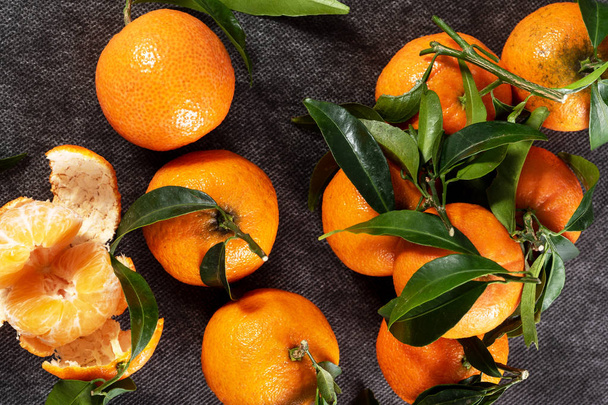 a closeup of delicious tangerines with leaves - Photo, Image