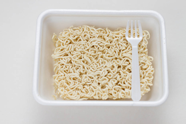 instant noodles in a lunchbox with fork - Photo, Image
