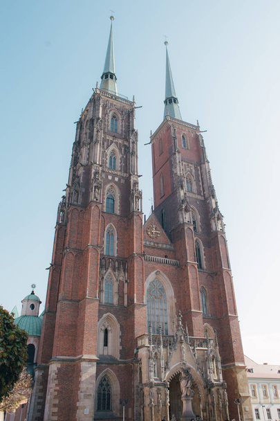 Beautiful Catholic church in Europe against the blue sky - Zdjęcie, obraz