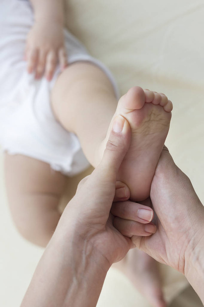 baby foot exercise close up - Фото, изображение