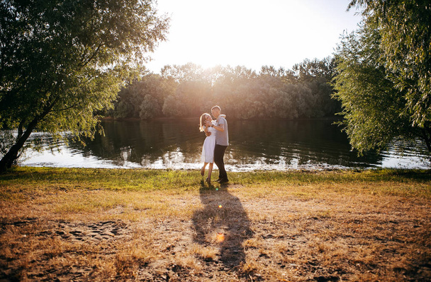 young couple in love posing on outdoor photo - session  - Photo, Image