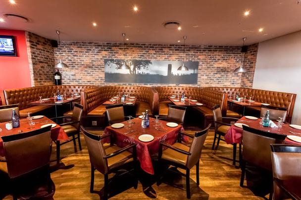 Johannesburg, South Africa - August 07 2013: Interior of Booth Style Restaurant Diner with Brown Interior - Foto, afbeelding