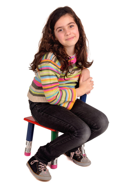 Little girl sitting in a chair - Фото, изображение