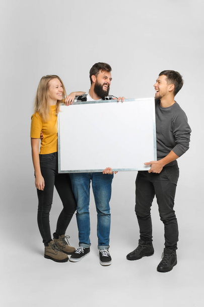 laughing people holding white board - Photo, Image