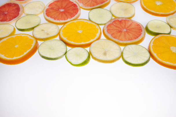 graphic resource, slices of citrus placed on translucent surface and illuminated from below - Photo, Image