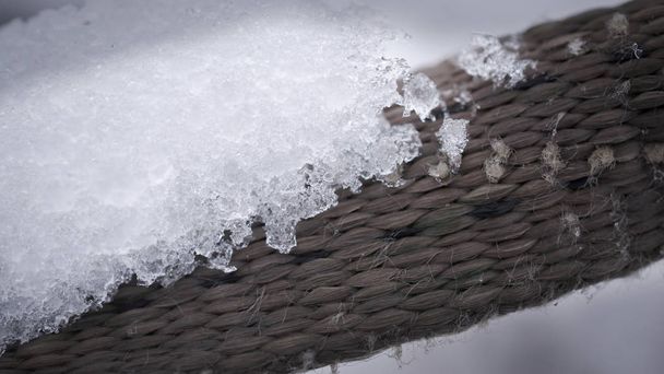 Ice on a brown rattan surface - Fotoğraf, Görsel