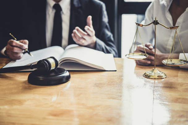 Male lawyer or Counselor working in courtroom have meeting with client are consultation with contract papers of real estate, Law and Legal services concept. - 写真・画像