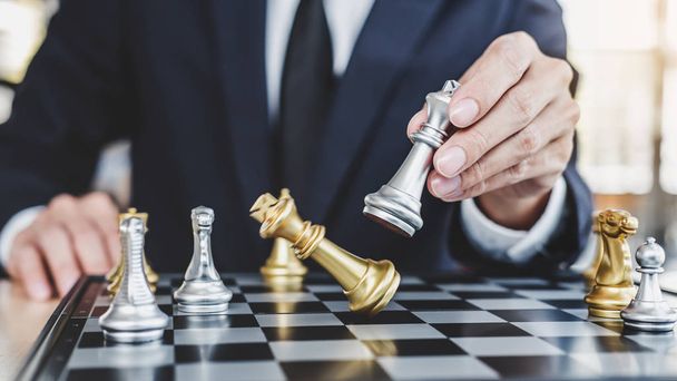 Businessman playing chess game reaching to plan strategy for success, thinking for planning overcoming difficulty and achieving goals business strategy for win, management or leadership concept. - Fotó, kép