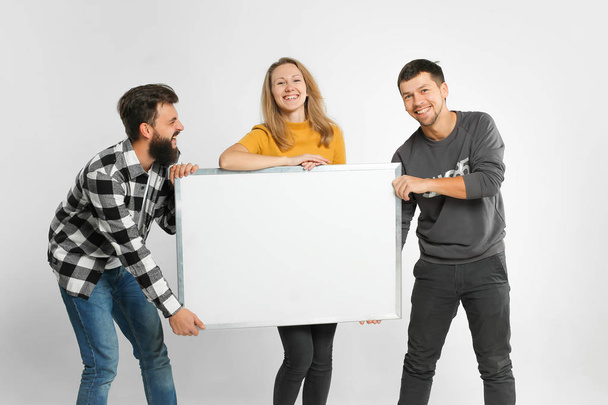 Young people holding white board - Photo, Image