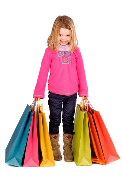 Little girl with shopping bags - 写真・画像