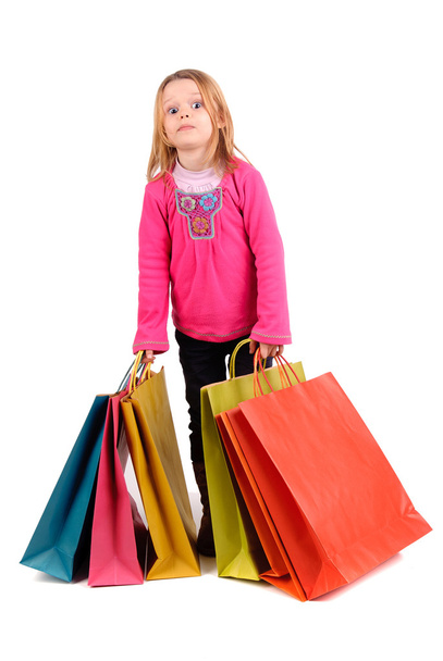 Little girl with shopping bags - Foto, afbeelding