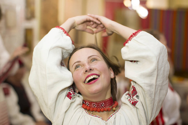Belarus, Gomel, November 24, 2018. Reconstruction of an ethnic old Belarusian wedding.A woman is dancing in a Slavic national costume. Belarusian girl.Ethnic national dance - Photo, Image