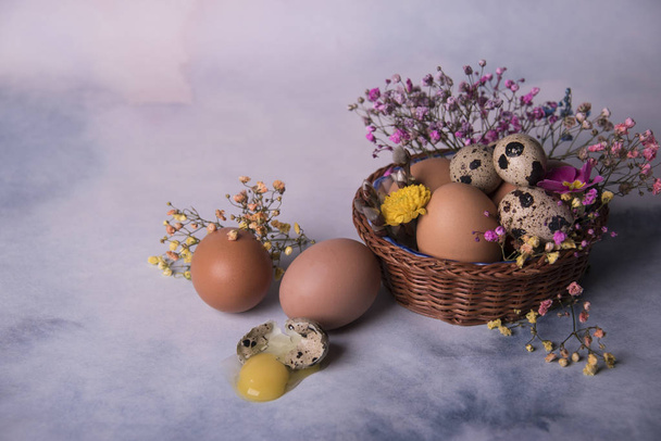 Happy Easter card template with eggs in basket and fresh flowers  - Photo, Image