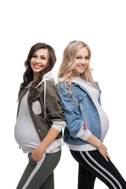 Happy preganant blonde and brunette isolated shot - Photo, Image
