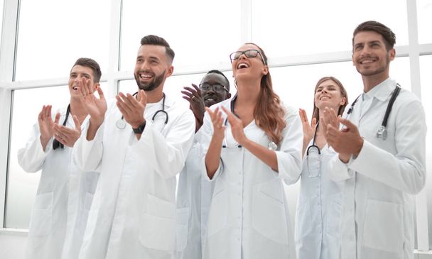 fellow doctors are applauding and smiling - Φωτογραφία, εικόνα