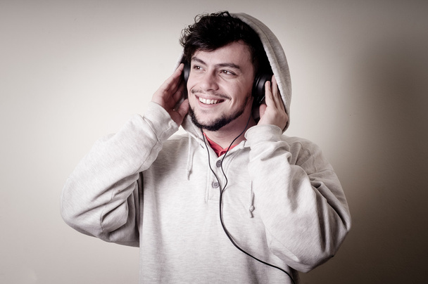 boy with sweatshirt and headphones - Фото, изображение
