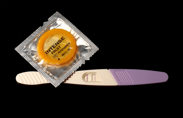 Pregnancy test and condom - Fotó, kép
