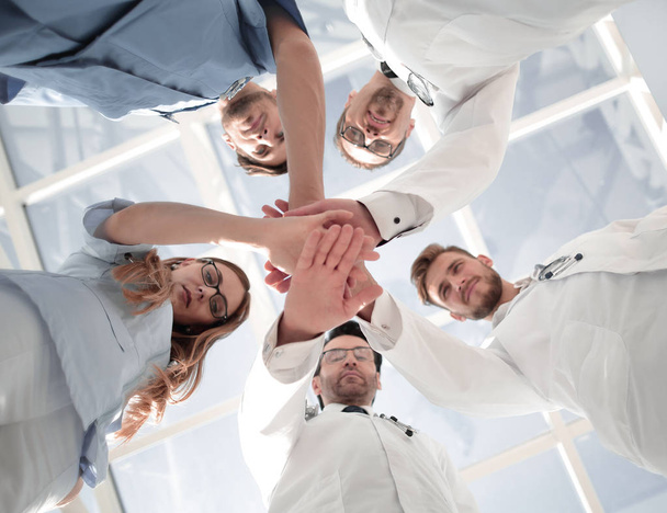 Portrait of a doctor team connecting hands stacking - Fotó, kép