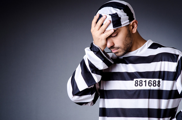 Convict criminal in striped uniform - Foto, afbeelding