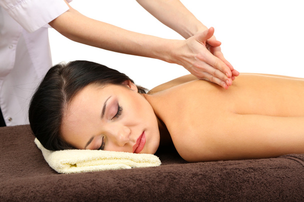 schöne junge Frau im Wellness-Salon bekommt Massage, isoliert auf weiß - Foto, Bild