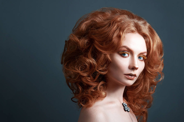 girl with red hair, creative makeup and eyelashes beautiful hairstyle - Valokuva, kuva