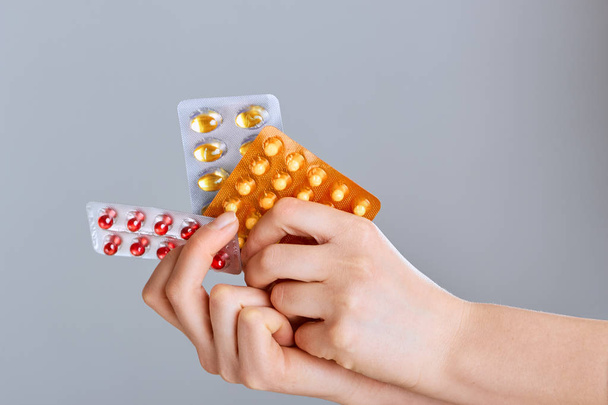 Concept Of The Global Healthcare And Medicine. Woman Holding Pack of Different Tablet Blisters Closeup. Life Save Service, Legal Drug Store, Prescribe Medication, Blood Pressure. - Image  - Foto, Imagen