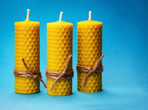 background three candles of yellow beeswax - 写真・画像