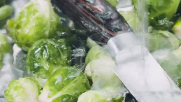 washing of fresh brussels sprouts and knife in sink, close up view - Video, Çekim