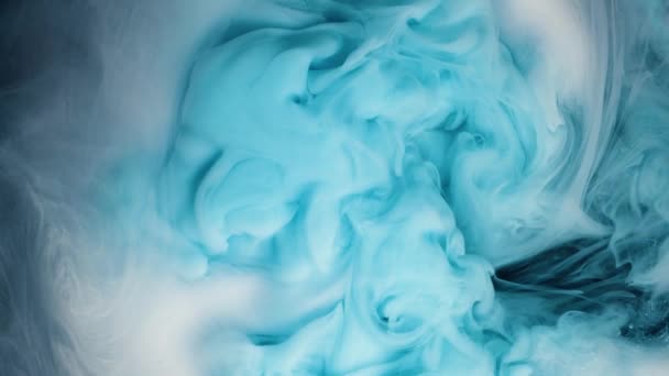 Turquoise ink spreading downward in water. Use for backgrounds or overlays requiring a flowing and organic look. - Footage, Video