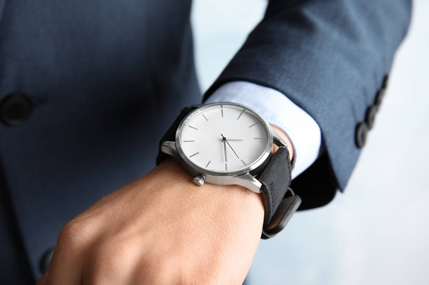 Businessman with stylish wrist watch, closeup. Time management - Фото, изображение
