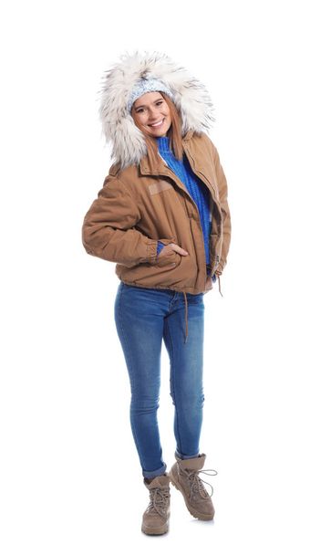 Young woman wearing warm clothes on white background. Ready for winter vacation - Foto, immagini
