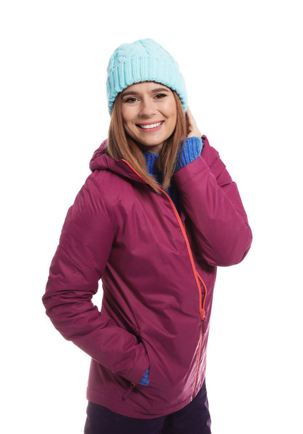 Young woman wearing warm clothes on white background. Ready for winter vacation - Foto, afbeelding