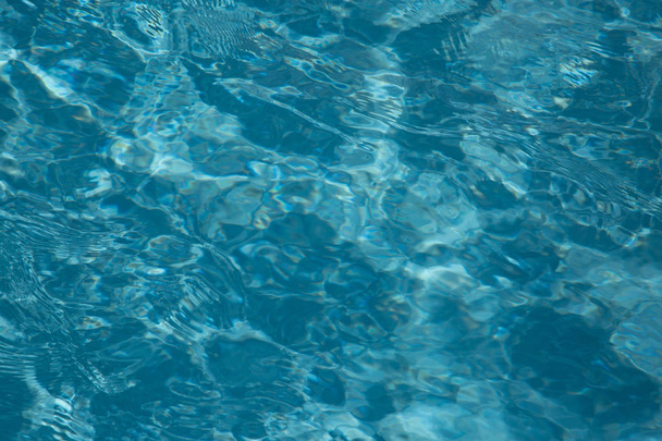Blue water ripple reflection in the swimming pool background - Fotografie, Obrázek