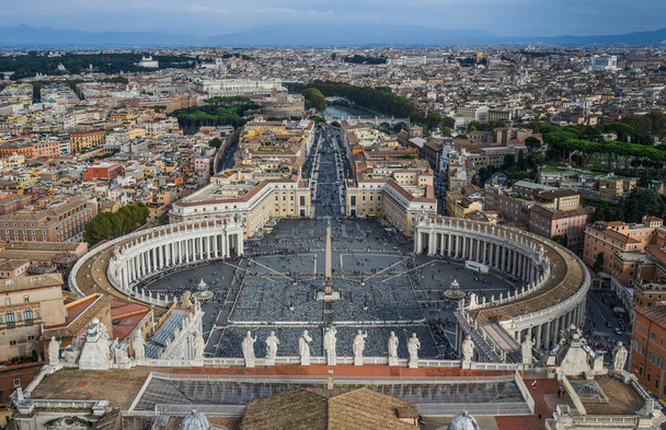 Looking down panorama view over Saint Peter Square (Piazza San Pietro) and Rome City, from St. Peter Basilica dome. - Photo, Image