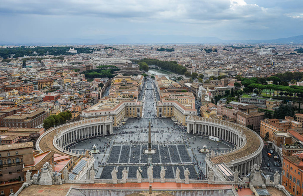 Looking down panorama view over Saint Peter Square (Piazza San Pietro) and Rome City, from St. Peter Basilica dome. - Photo, Image