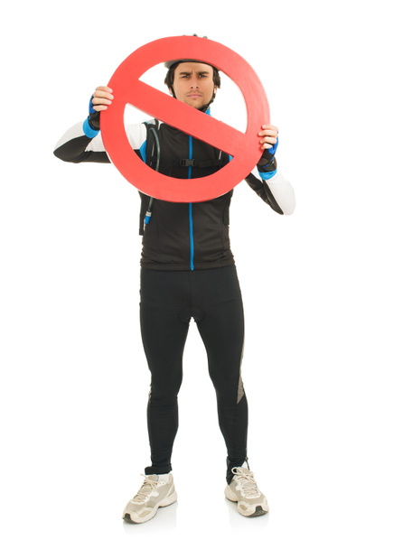Молодой велосипедист держит запретный знак
 - Фото, изображение