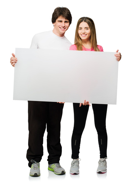 mutlu genç bir çift boş afişini holding - Fotoğraf, Görsel